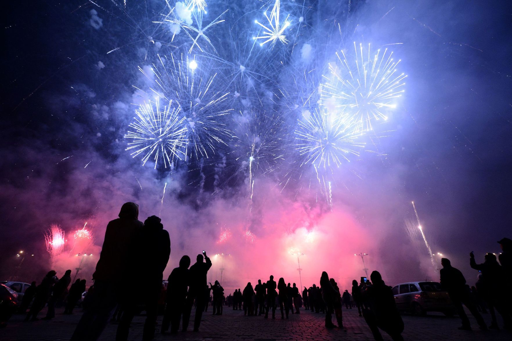 Purple fireworks people in shadow